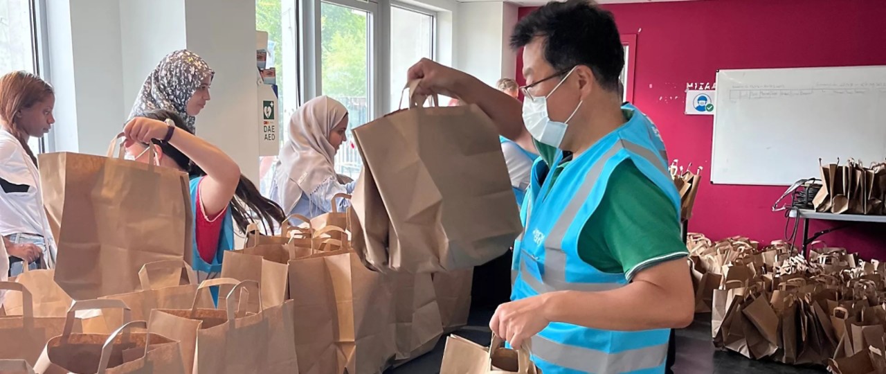 Toyota executive preparing bags to be shared with the homeless in Brussels